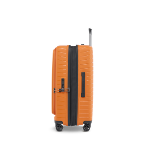 Seitenansicht des flexiblen Multi-Load-Koffers in Rosso Clay mit ergonomischem Tragegriff und schlankem Profil
